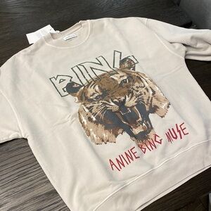 Poshmark Anine Bing Tiger sweatshirt in light grey color.